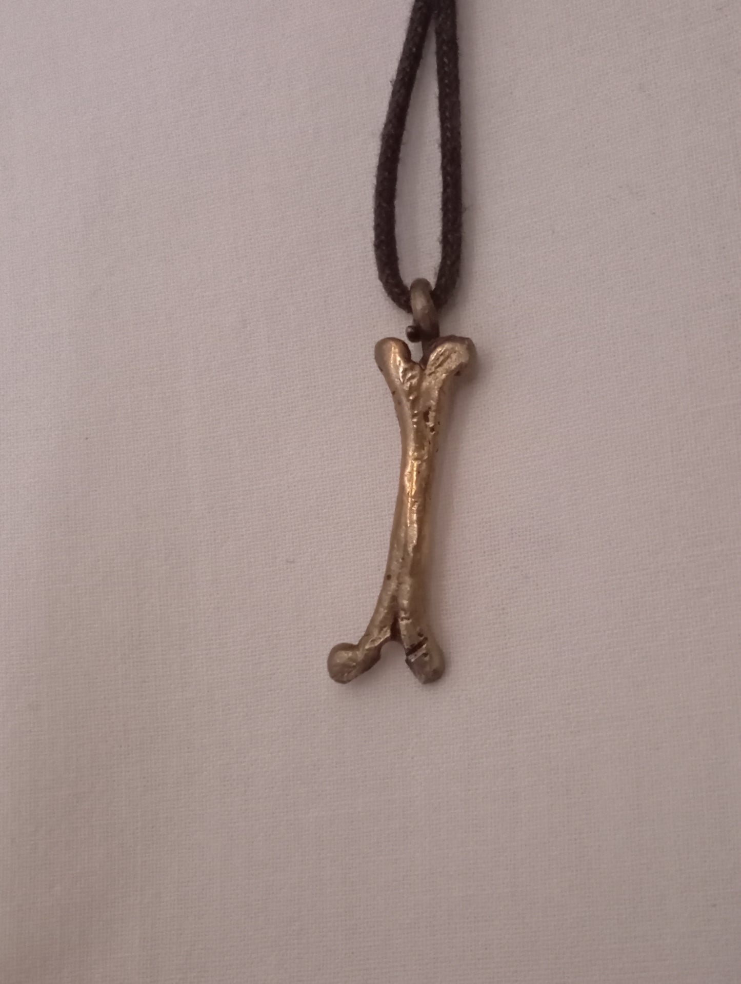 Colgante hueso bronce